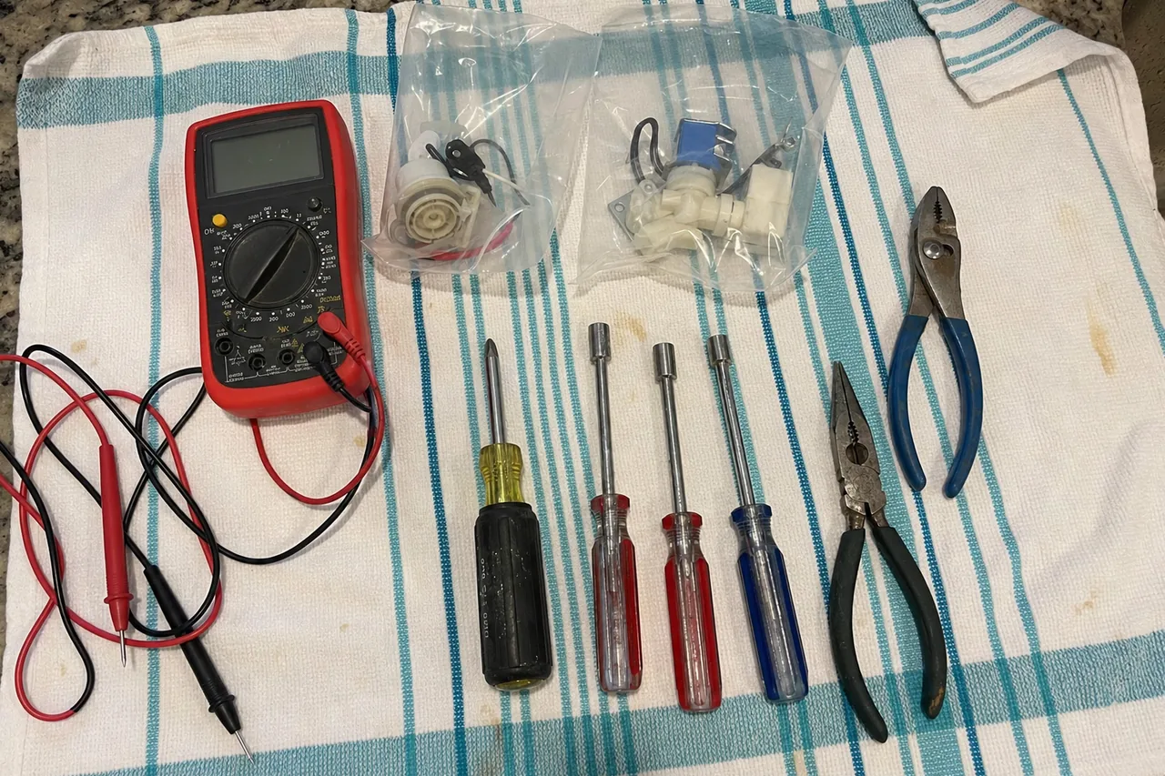 A commercial repair technician's tools laid out