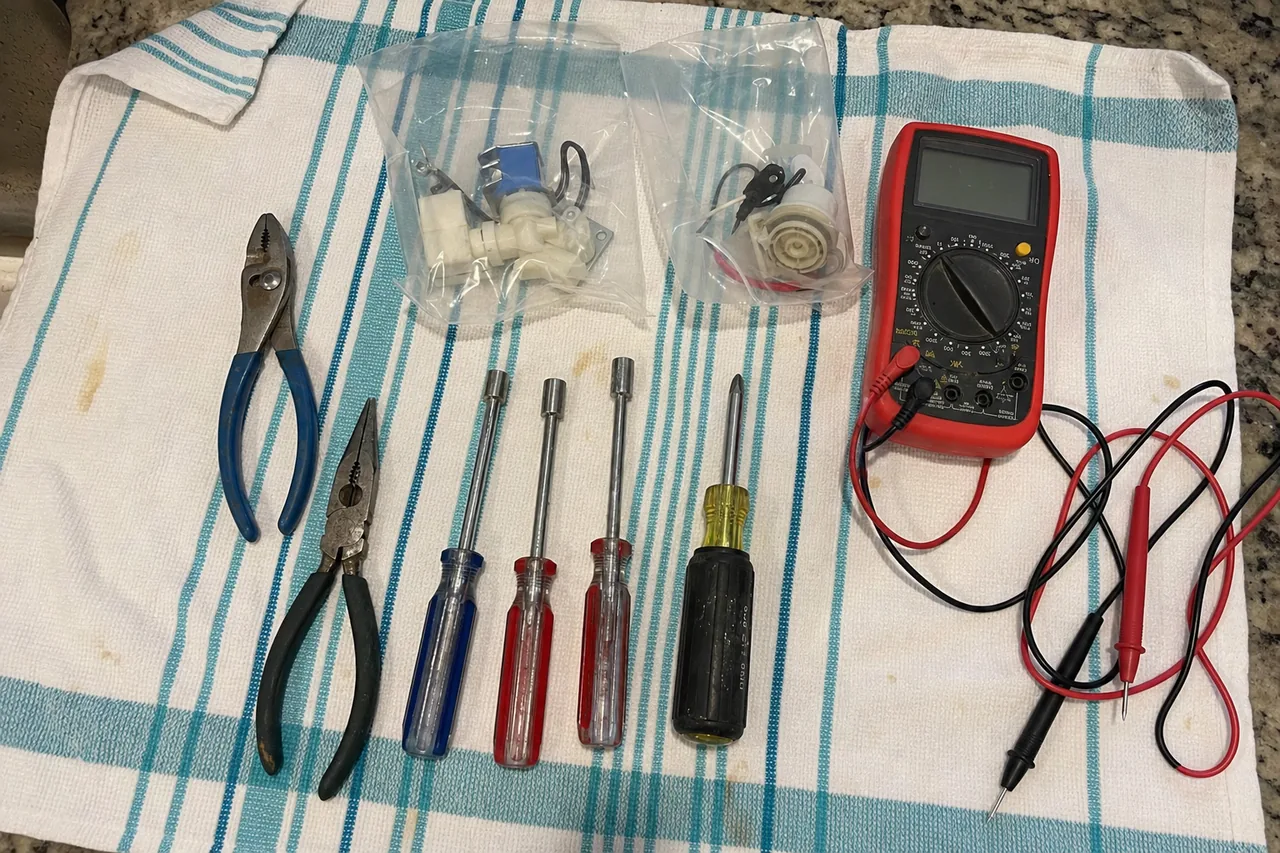 A commercial repair technician's tools laid out in a Bergen County kitchen